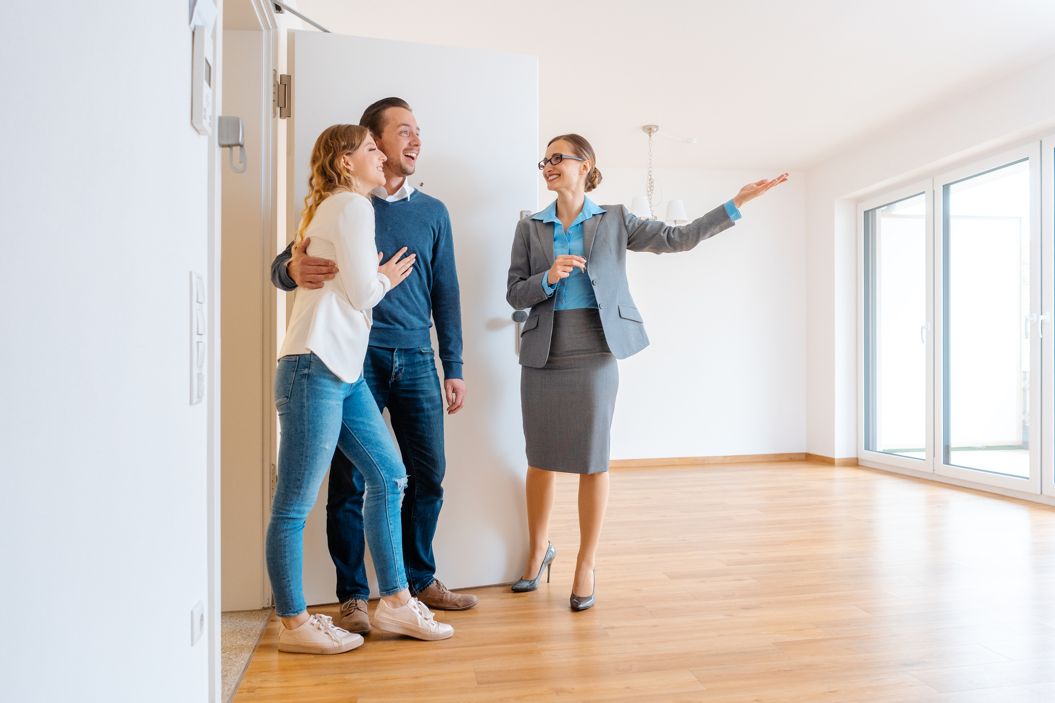 Realtor showing house to a young couple wanting to rent it