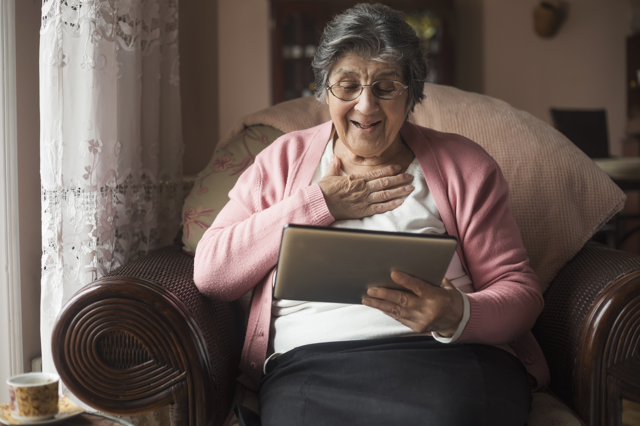 senior woman at home watching YouTube