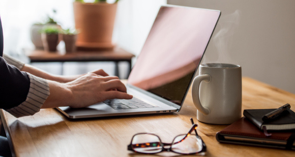 Person typing on laptop.