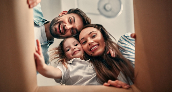 family looking into moving box