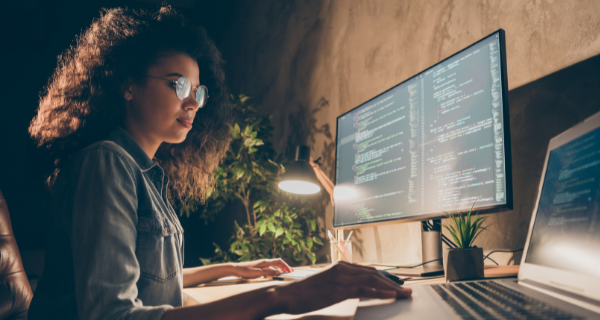 woman coding on a computer