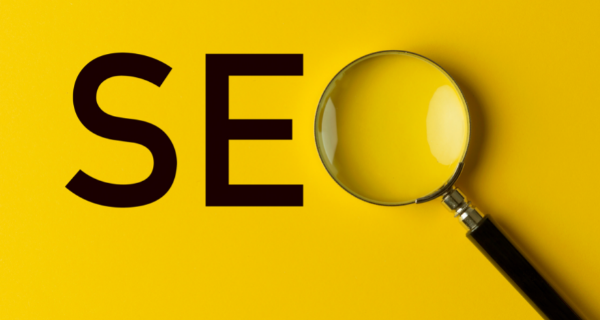 Image with SEO spelled out with a magnifying glass as the O.