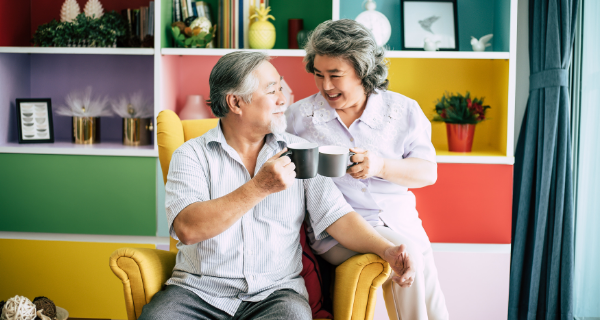 two seniors drinking coffee together