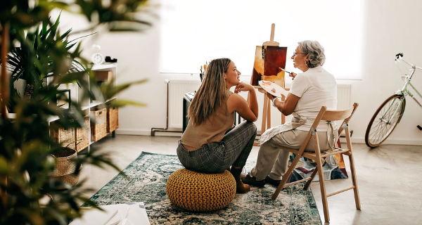 Senior and family member talking about a loved one.