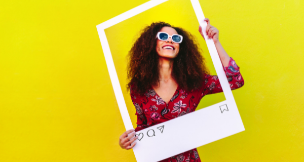 Image of person standing inside a white frame that looks like an Instagram frame.